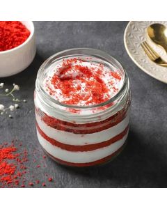 Sugar free red velvet jar cake layered with cream in a glass jar